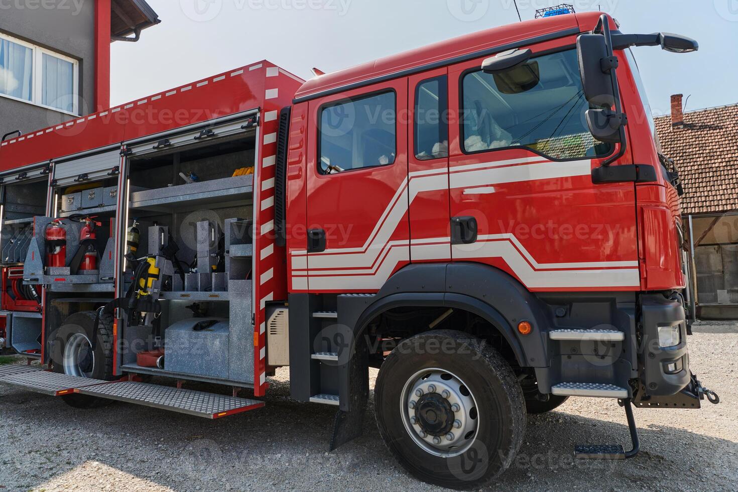 A state-of-the-art firetruck, equipped with advanced rescue technology, stands ready with its skilled firefighting team, prepared to intervene and respond rapidly to emergencies, ensuring the safety photo