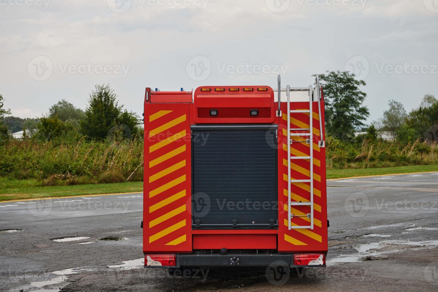 A state-of-the-art firetruck, equipped with advanced rescue technology, stands ready with its skilled firefighting team, prepared to intervene and respond rapidly to emergencies, ensuring the safety photo