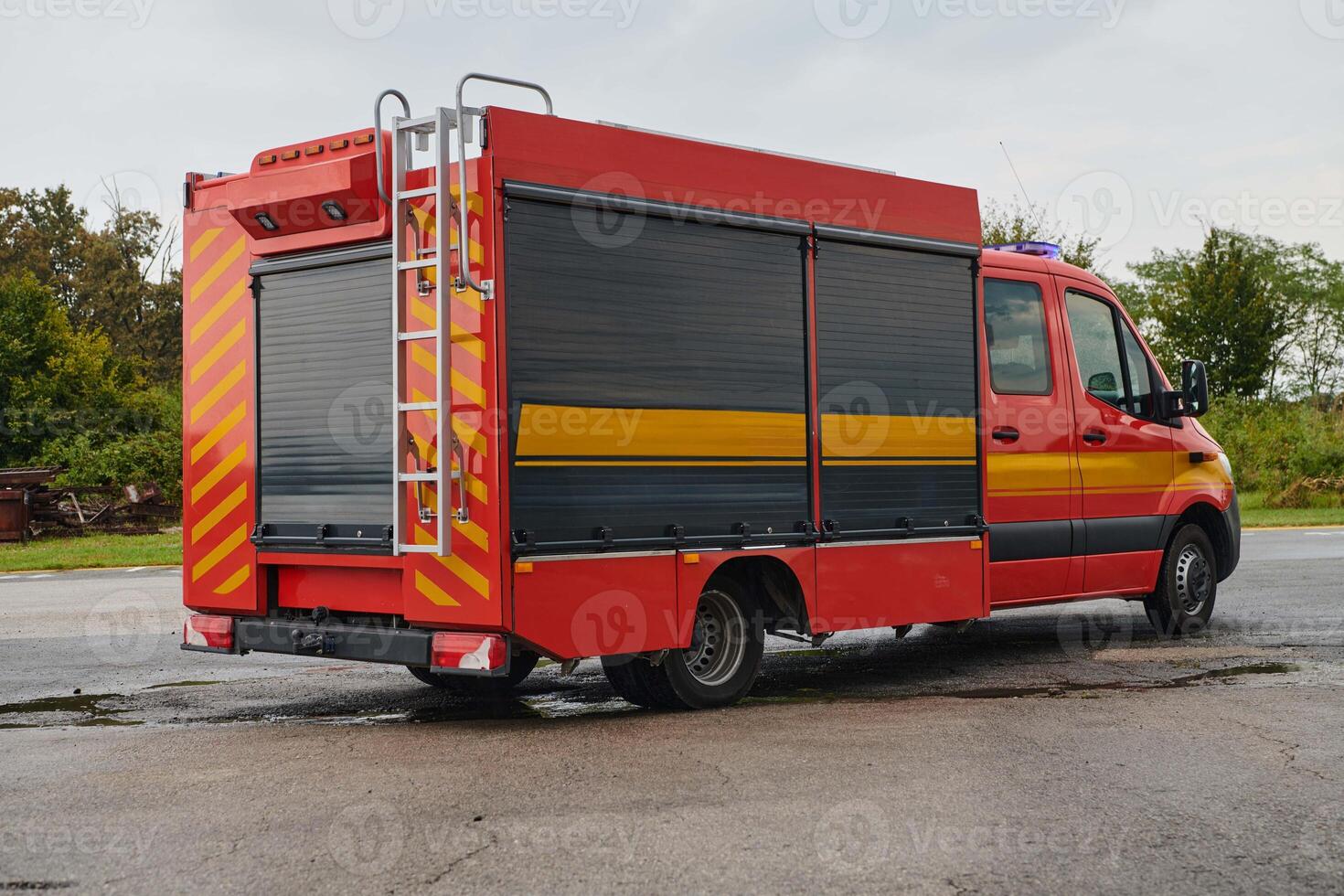 A state-of-the-art firetruck, equipped with advanced rescue technology, stands ready with its skilled firefighting team, prepared to intervene and respond rapidly to emergencies, ensuring the safety photo