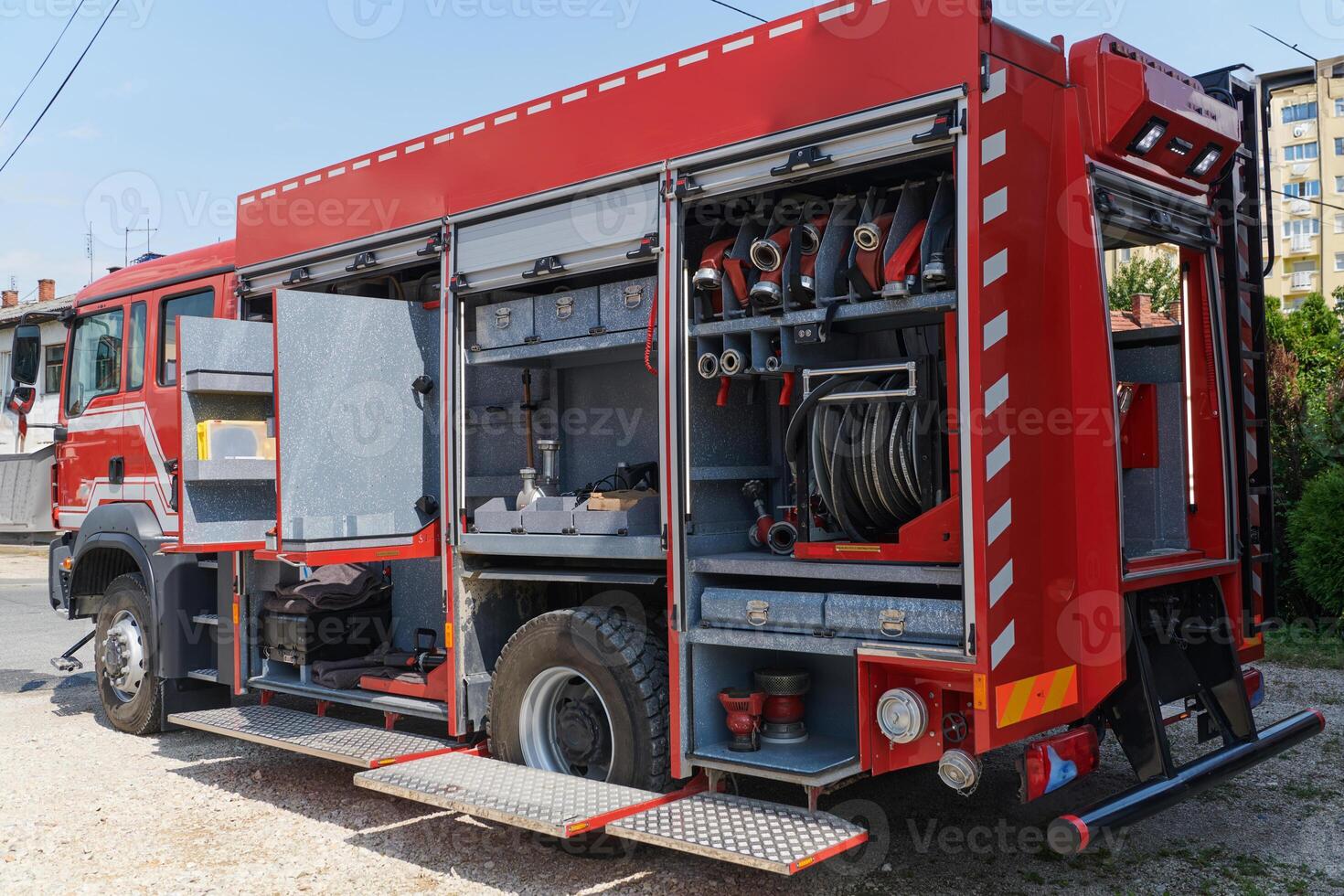 Close-up of essential firefighting equipment on a modern firetruck, showcasing tools and gear ready for emergency response to hazardous fire situations photo