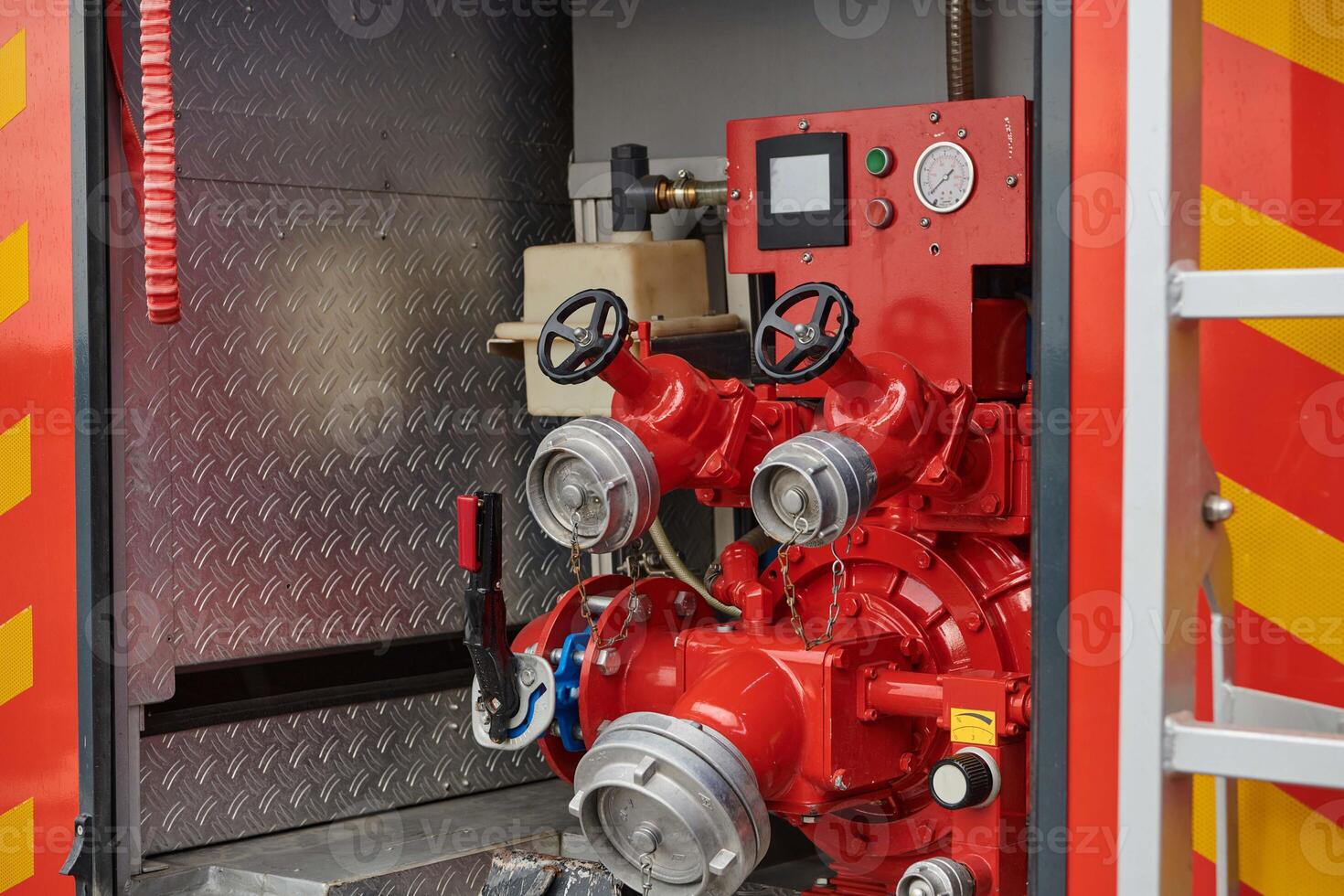 Close-up of essential firefighting equipment on a modern firetruck, showcasing tools and gear ready for emergency response to hazardous fire situations photo
