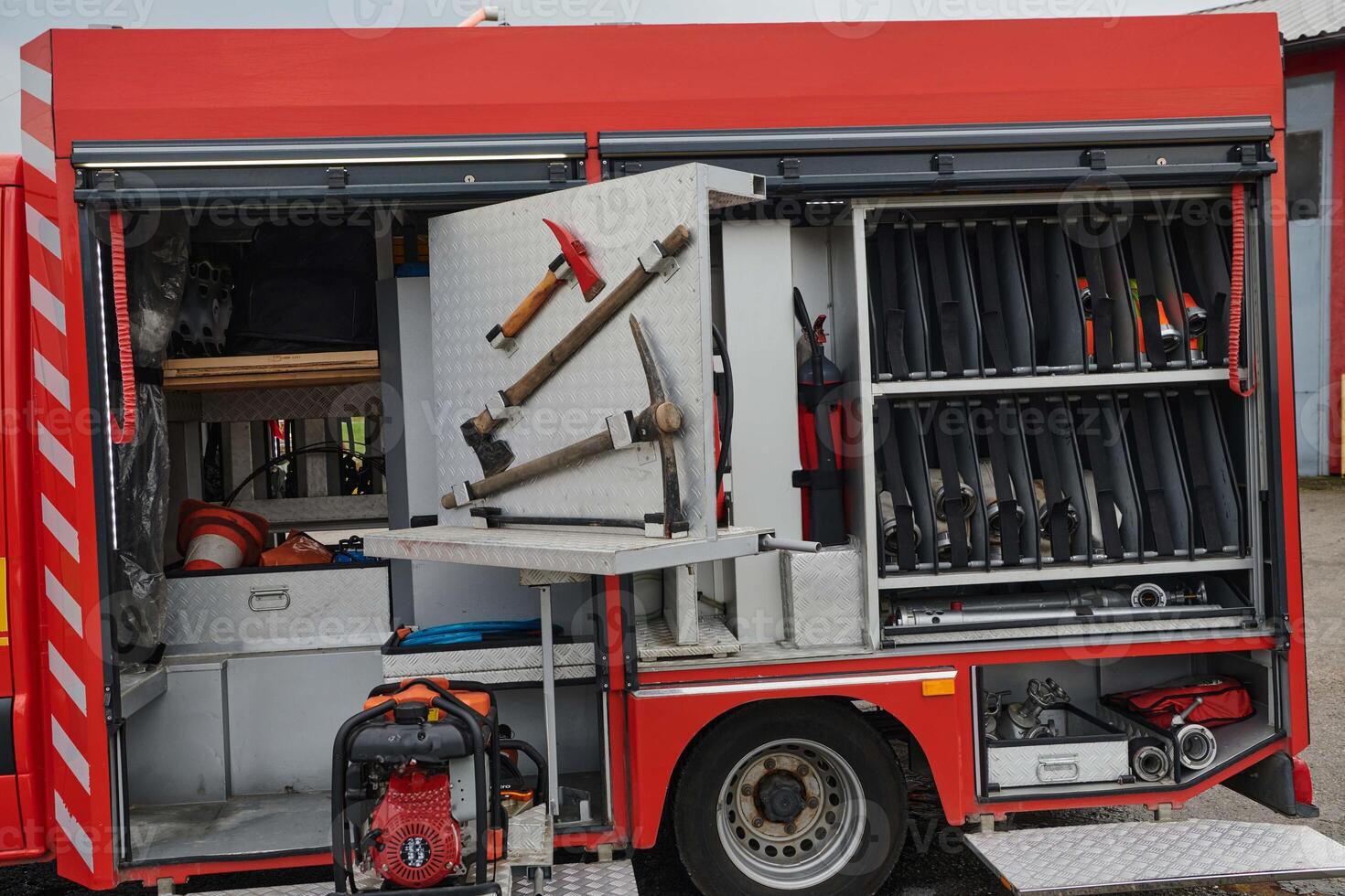 Close-up of essential firefighting equipment on a modern firetruck, showcasing tools and gear ready for emergency response to hazardous fire situations photo
