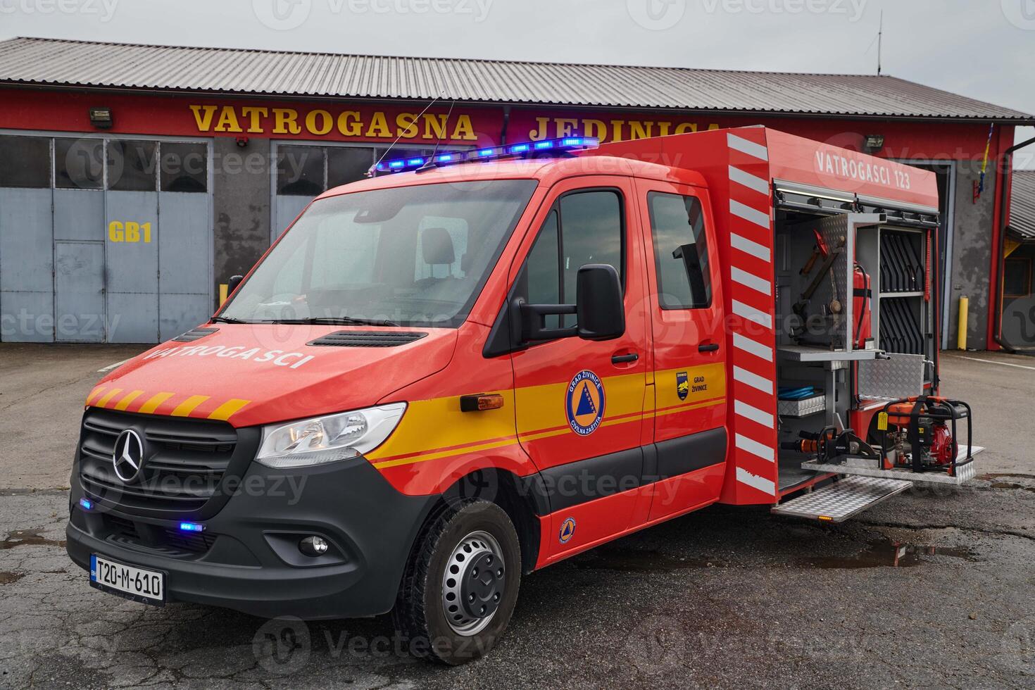 A state-of-the-art firetruck, equipped with advanced rescue technology, stands ready with its skilled firefighting team, prepared to intervene and respond rapidly to emergencies, ensuring the safety photo