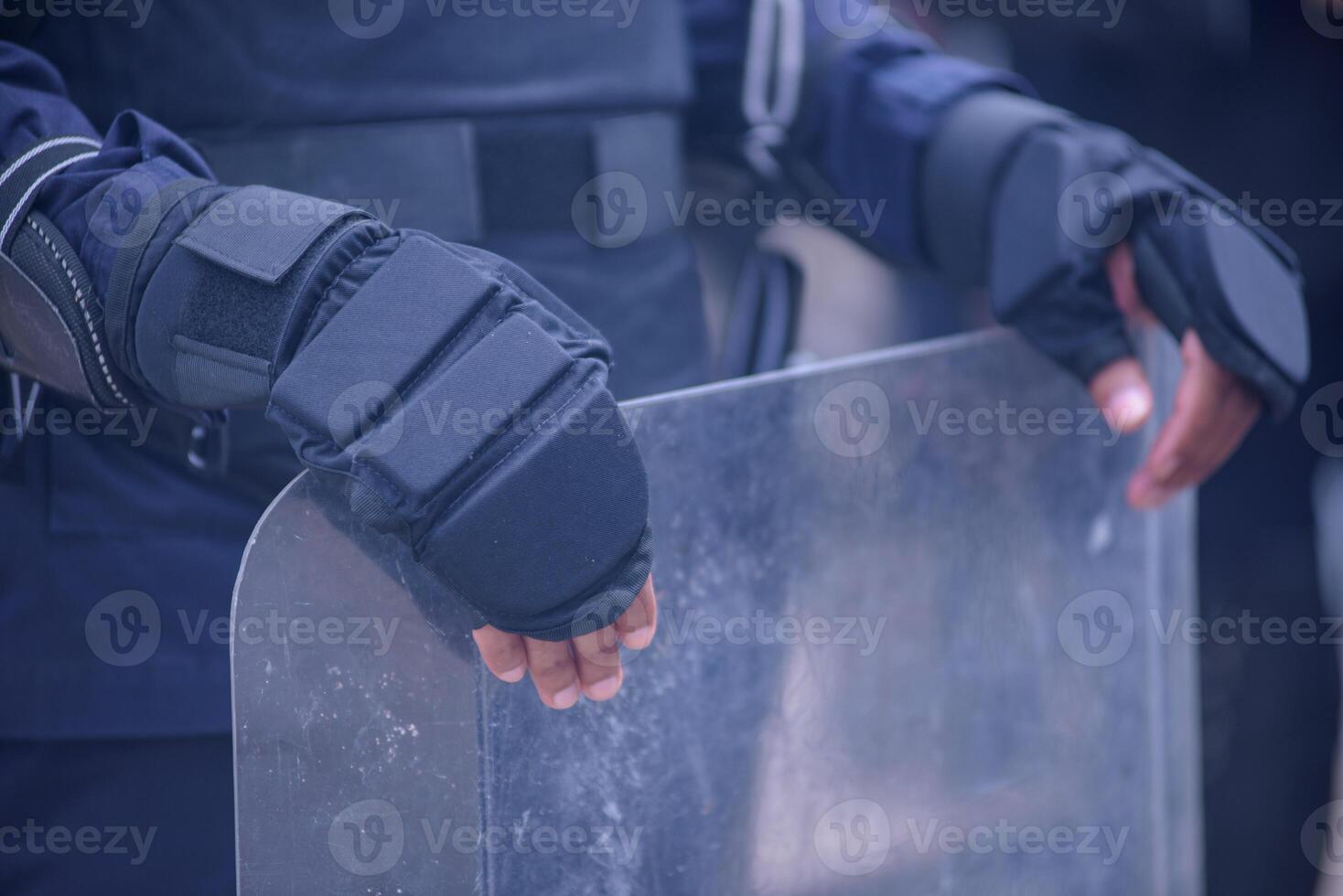Riot police practice shields and baton photo