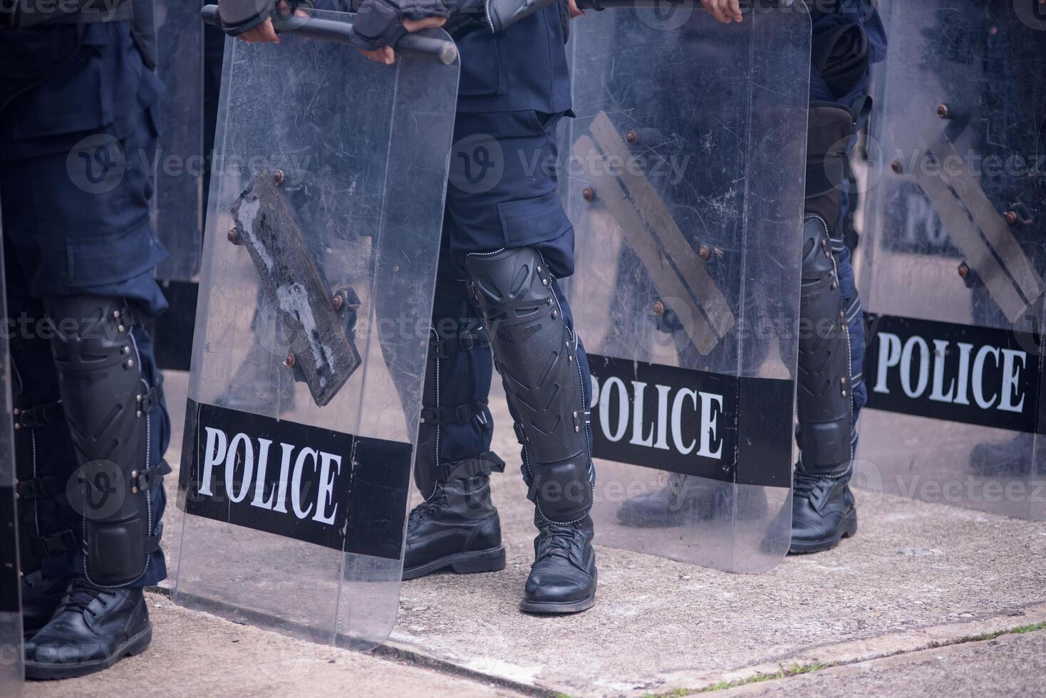 Riot police practice shields and baton photo