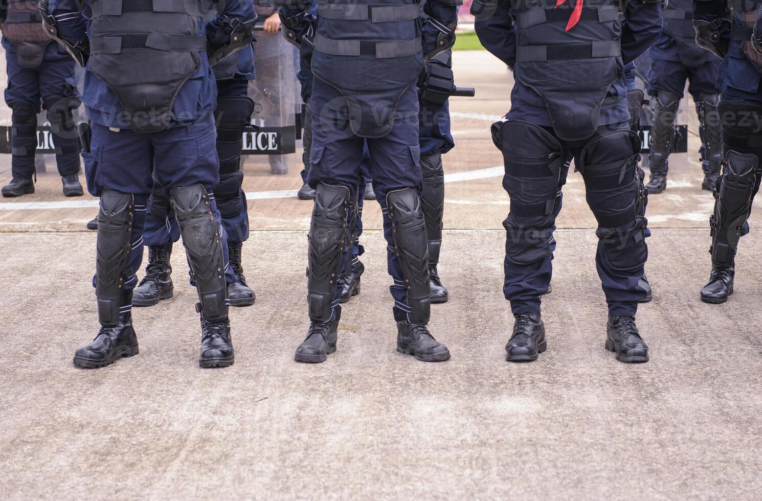 Riot police practice shields and baton photo