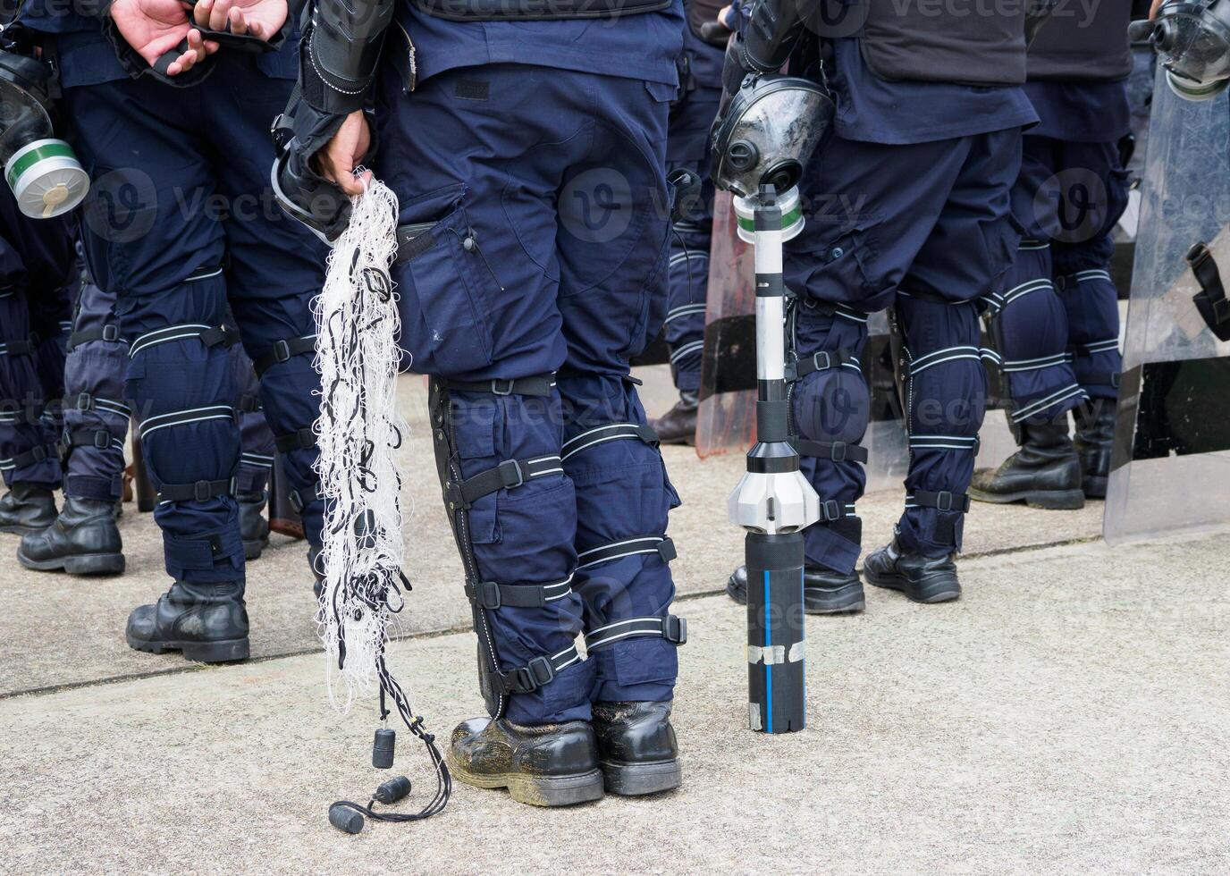 Riot police practice shields and baton photo
