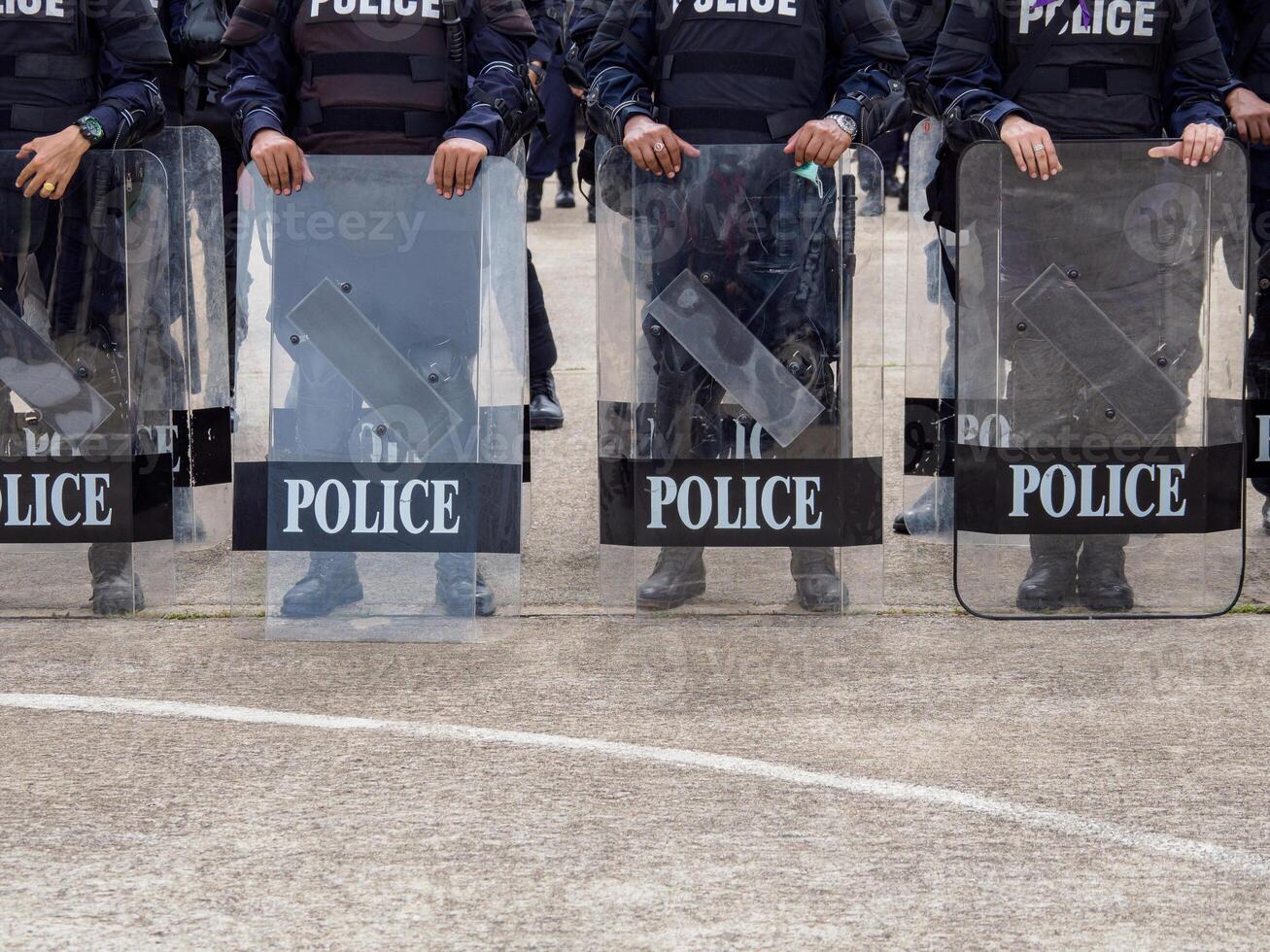 Riot police practice shields and baton photo