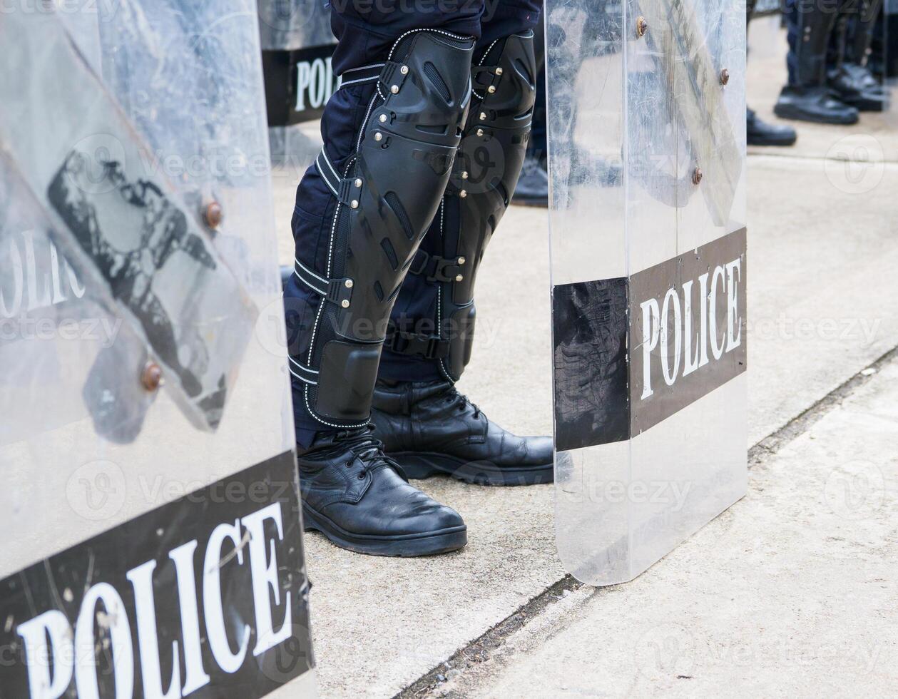 Riot police practice shields and baton photo
