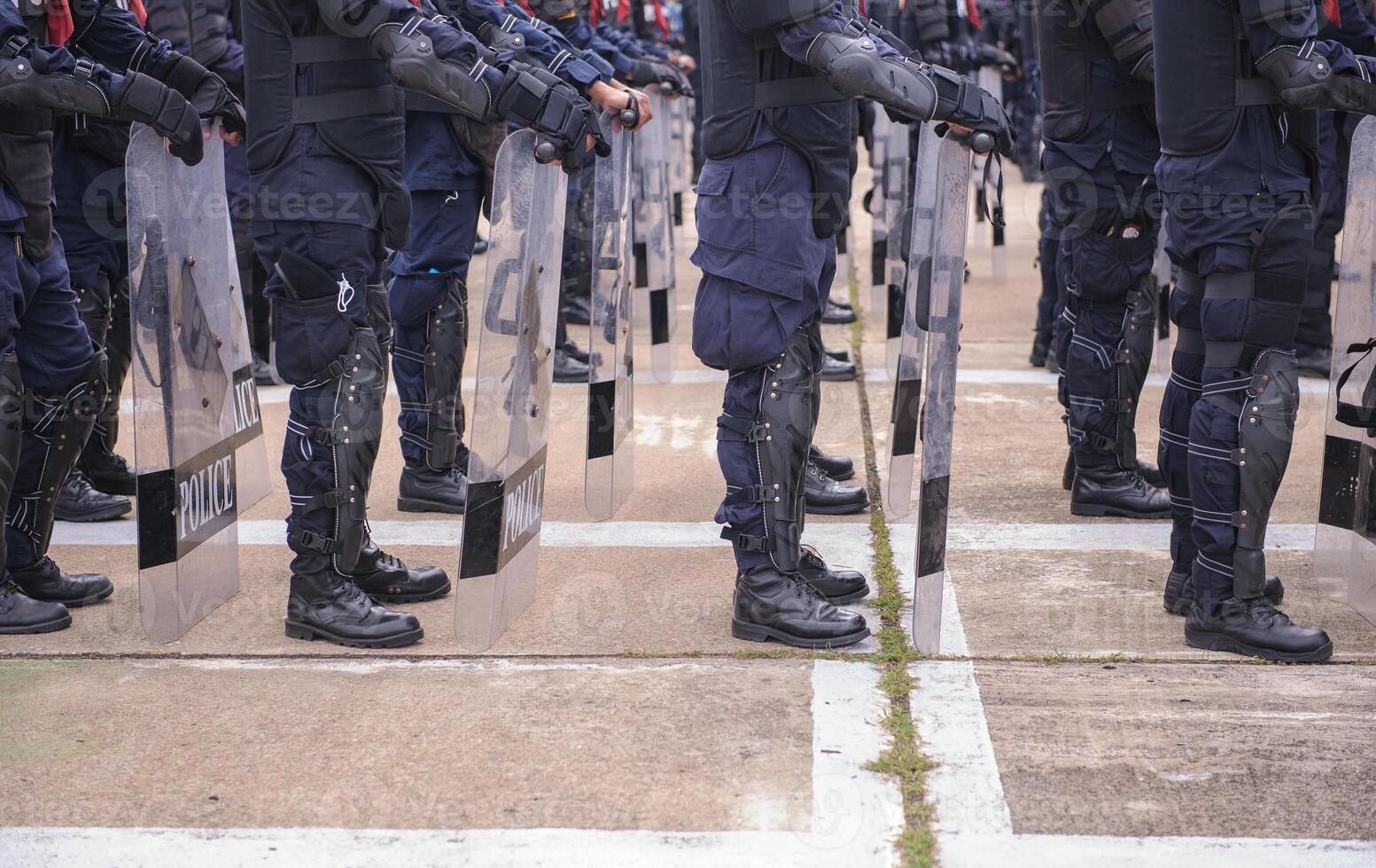 Riot police practice shields and baton photo