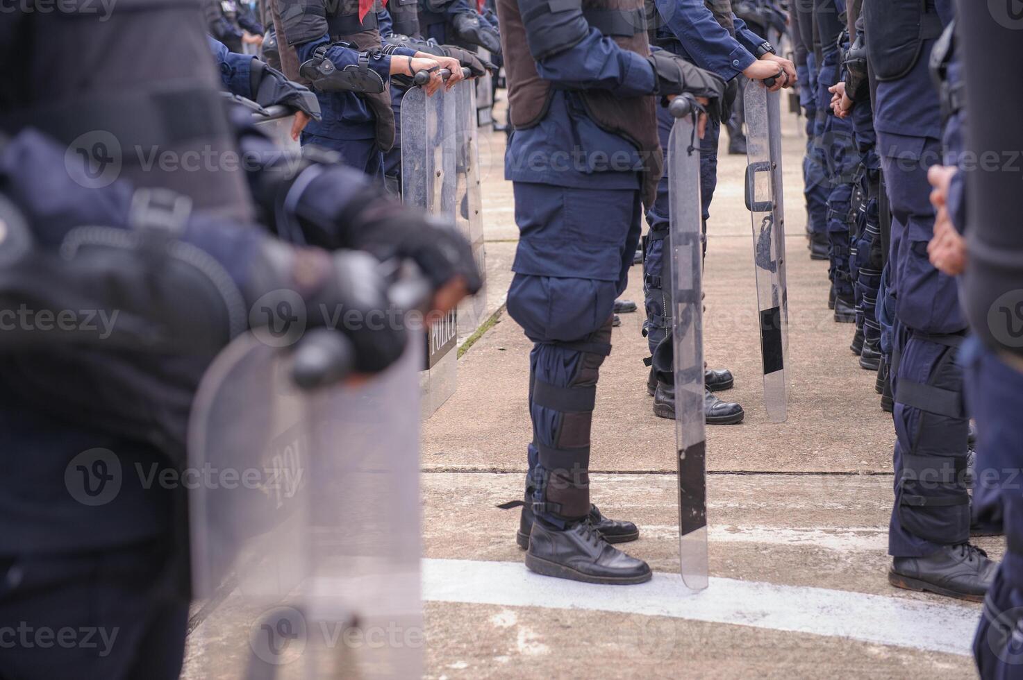 Riot police practice shields and baton photo