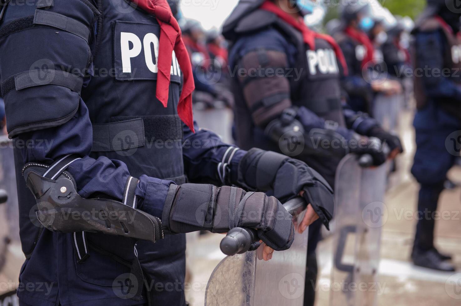 Riot police practice shields and baton photo