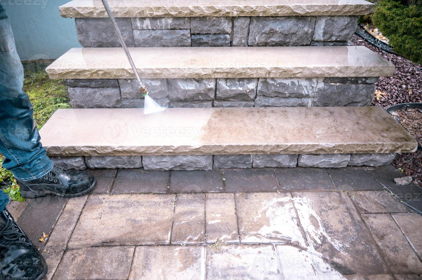 pressure water jet during cleaning dirty outdoor porch stairs with copy-space photo
