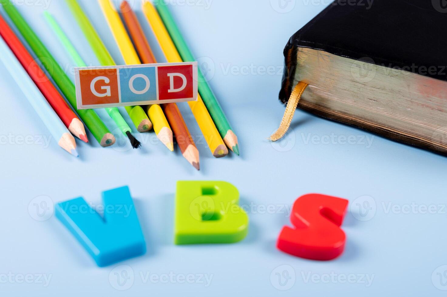Church background with Abbreviation VBS, Vacation Bible School next to black bible . Copy space text. photo