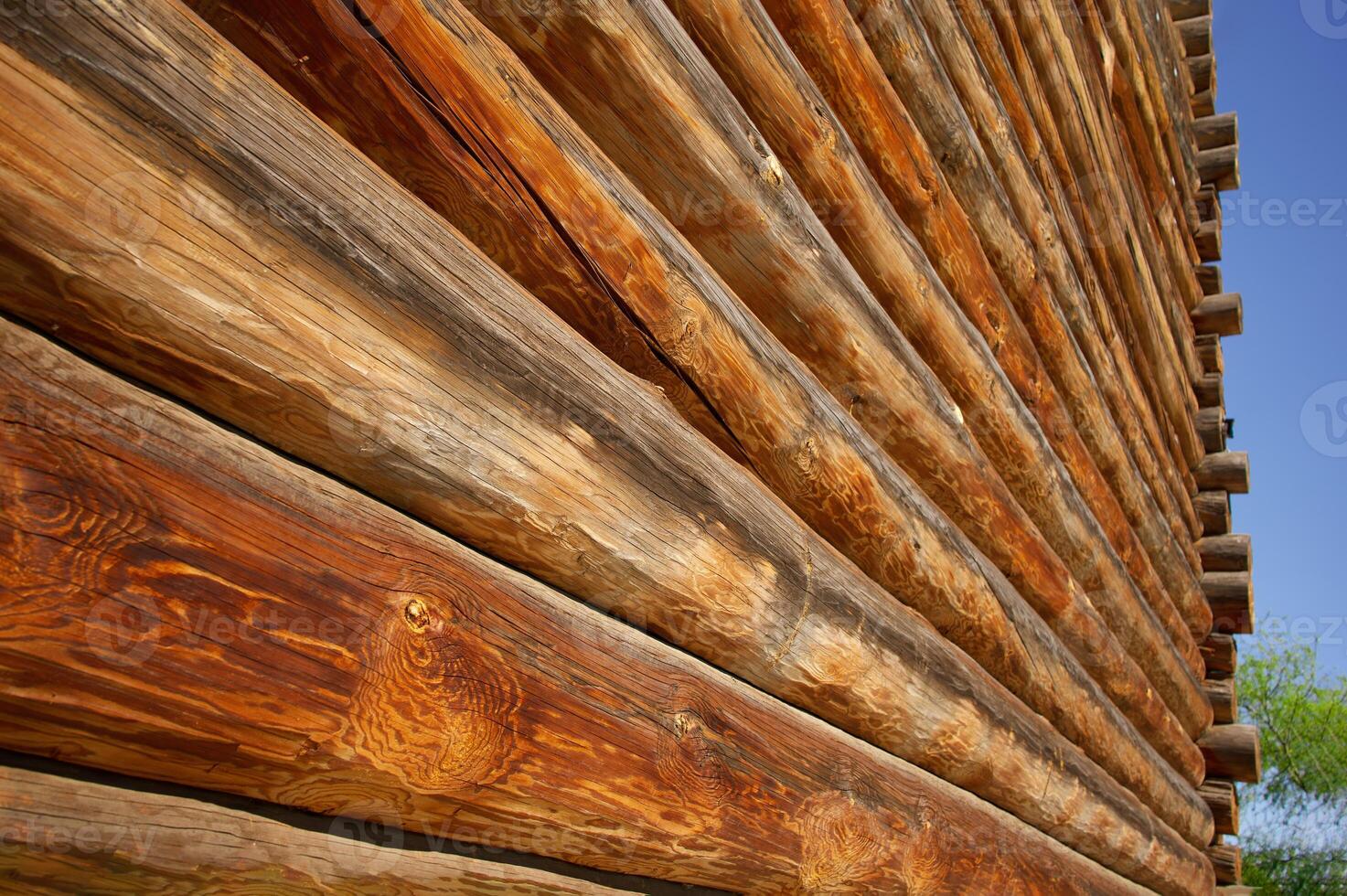 An old wooden building, round timber. The building is made of wood. photo