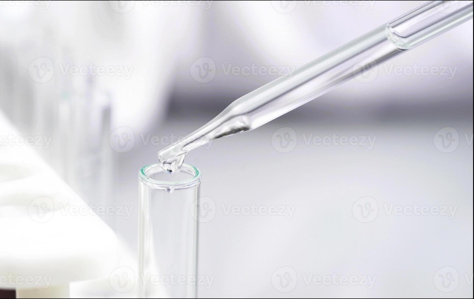 Scientist holding test tube in science lap photo
