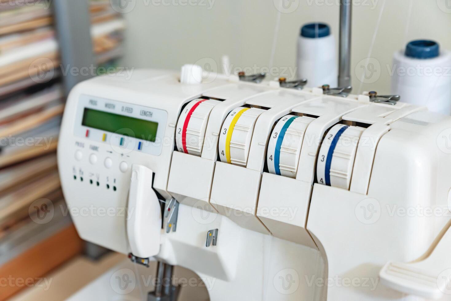 Front of a sewing machine loaded with threads photo