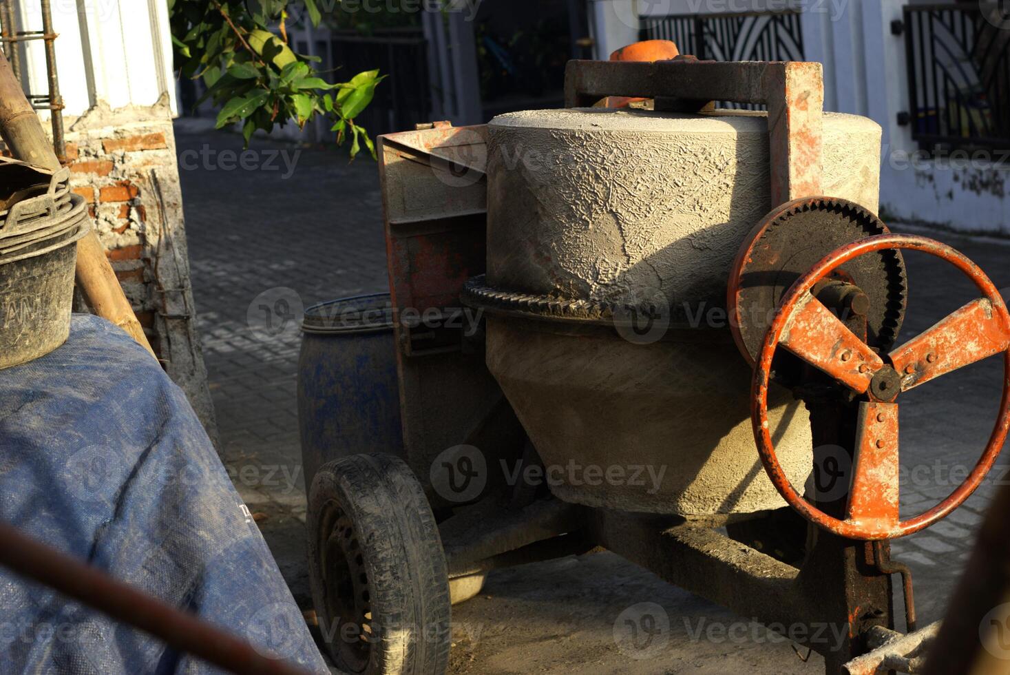 Cement mixer in a construction site, concrete maker machine photo
