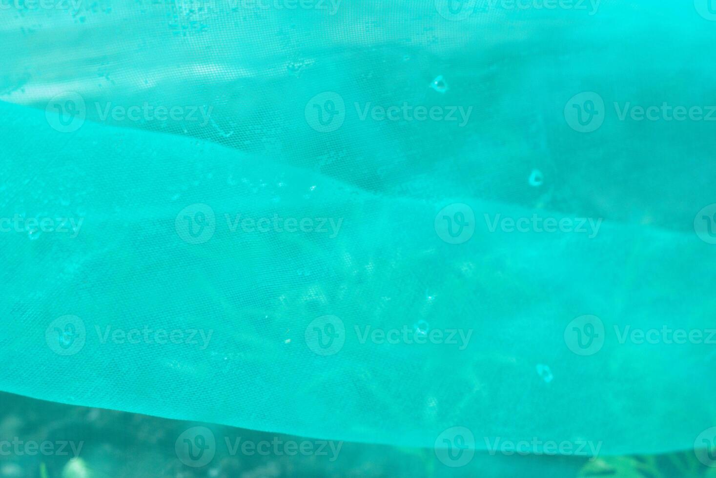 green nylon net with drop of water photo