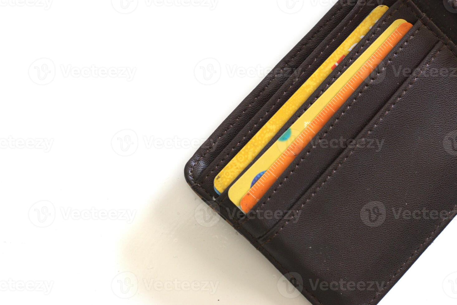 Leather wallet with credit card inside it, isolated on white background with copy space area photo