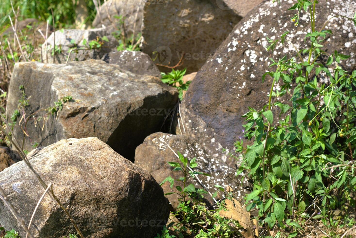 A rock formation on a nature, group of rock boulder photo