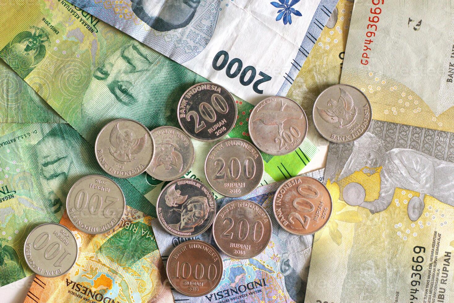 Heap of money, Assorted Indonesian rupiah banknotes and coins for business background photo