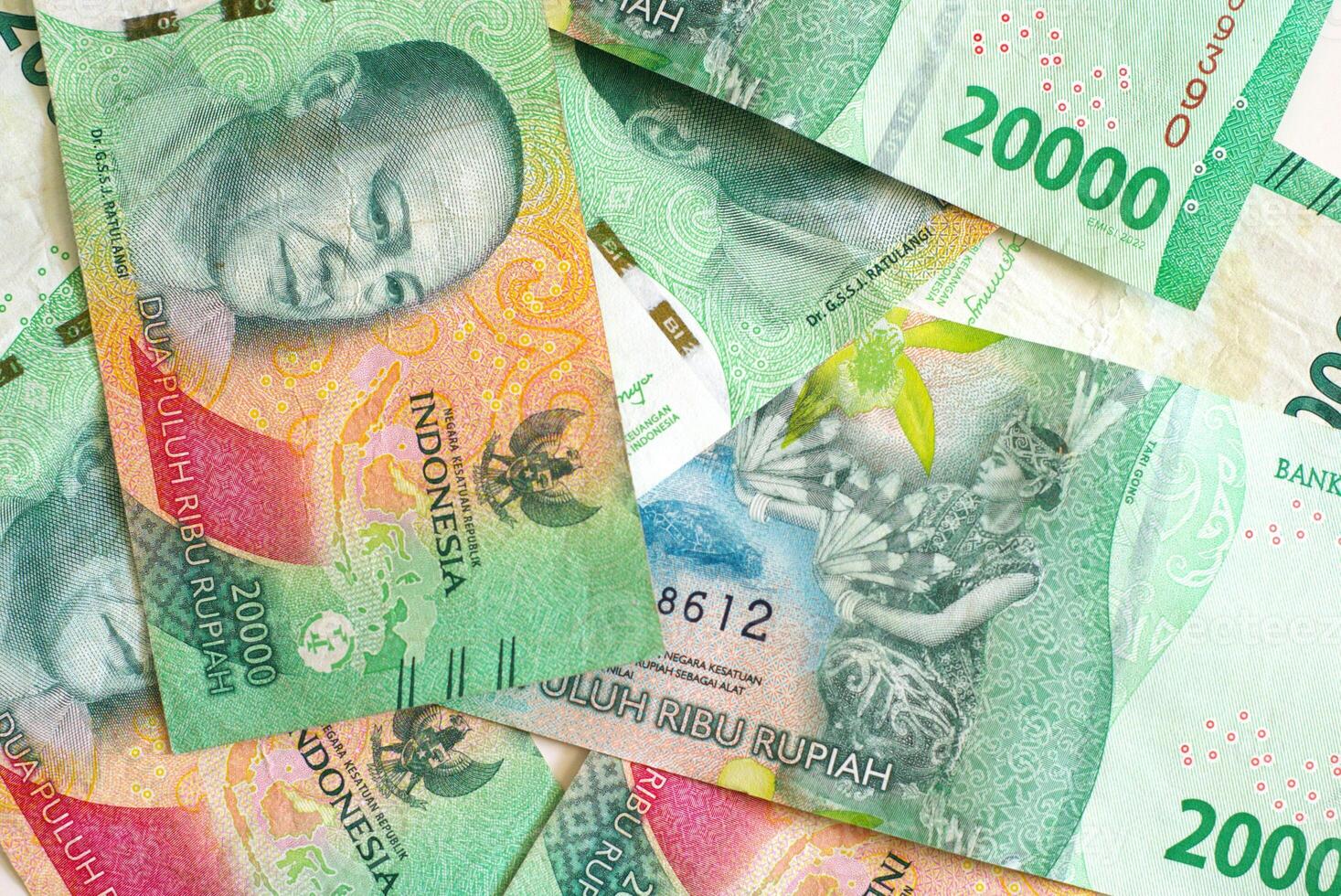 Heap of twenty thousand rupiah banknotes, Indonesian Currency background photo