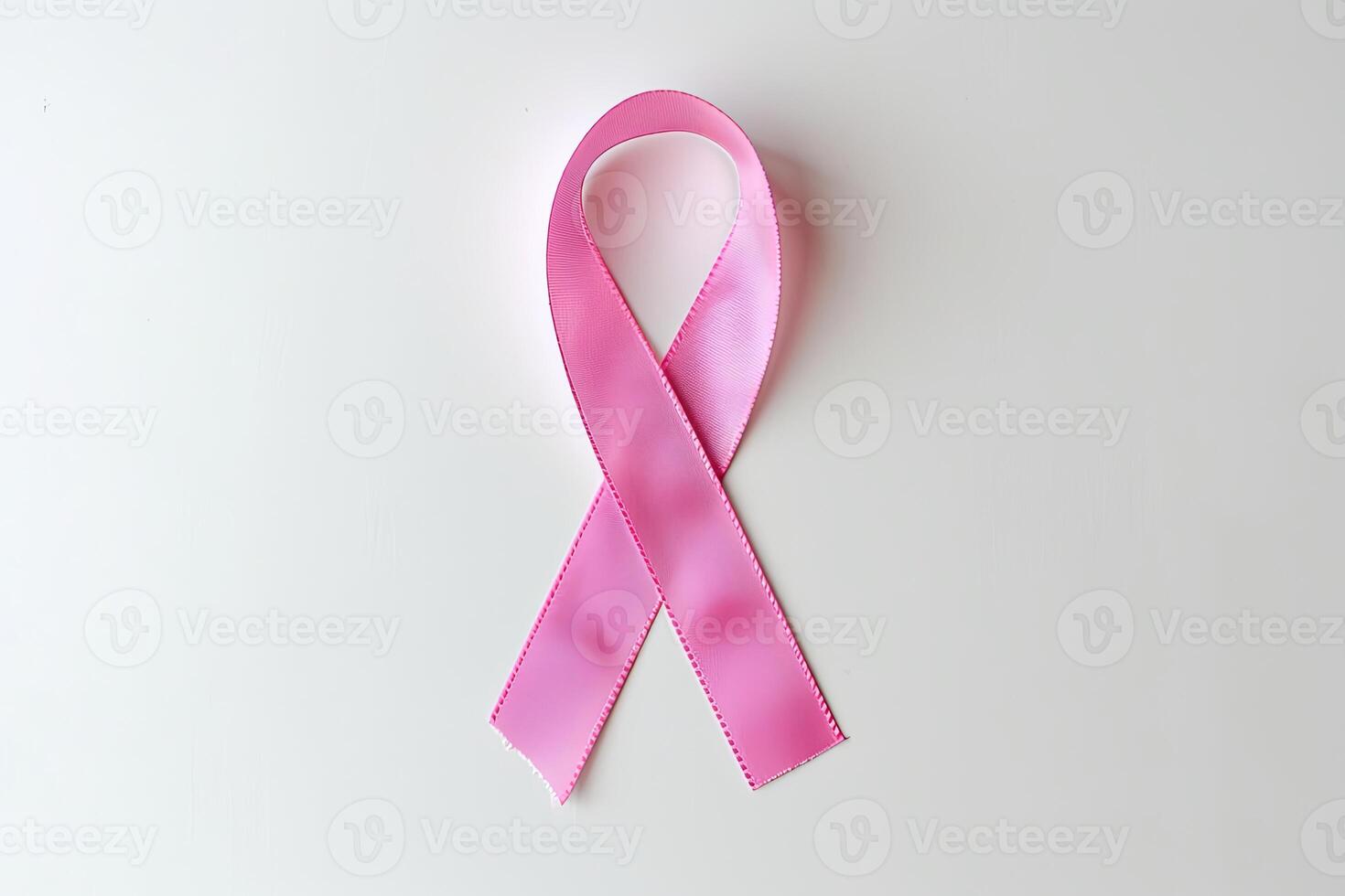 Pink Cancer Ribbon on White Background. Minimalistic Design photo