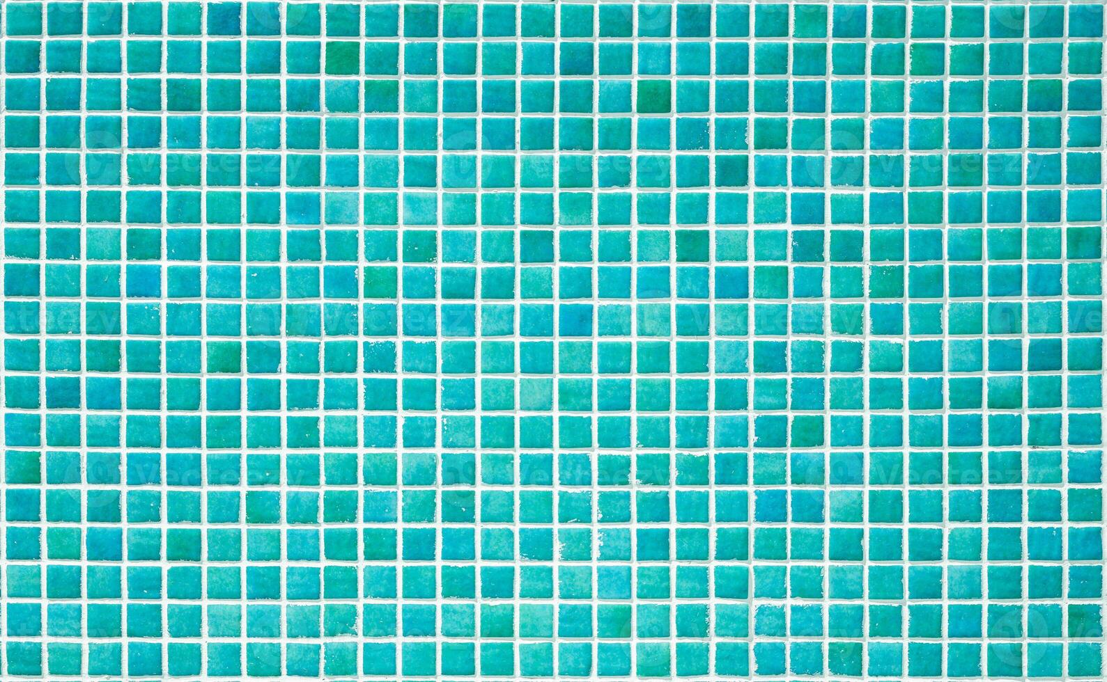 Texture of a wall covered with decorative brick-like tiles mosaic. Abstract background for design. photo