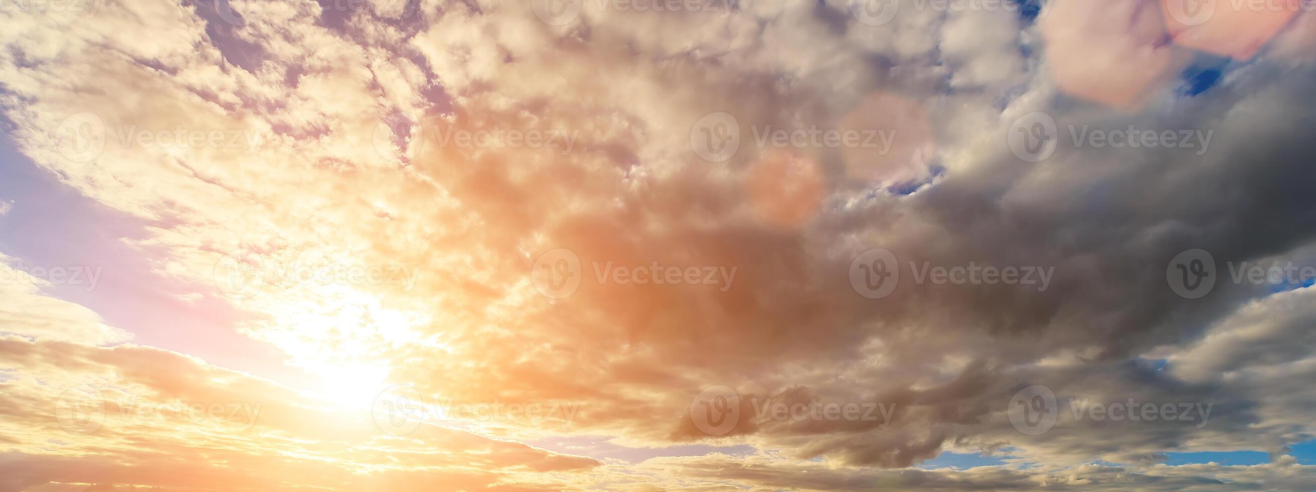 The rays of the sun breaking through the clouds in the evening or in the morning in the sunset or dawn sky. The concept of faith, hope for the best or good weather. photo