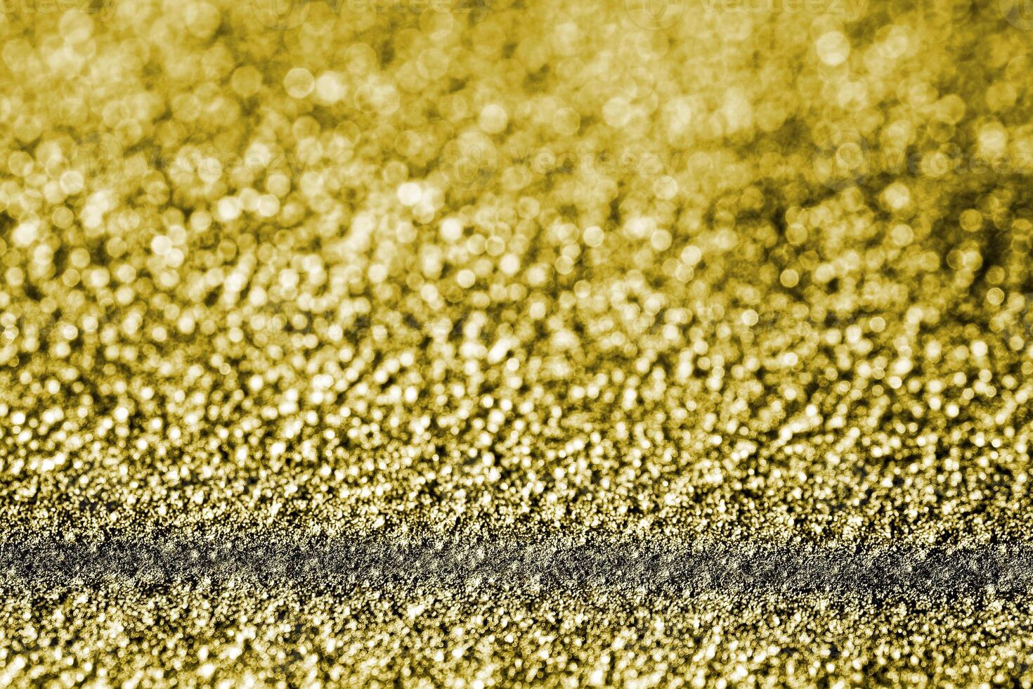 Golden texture of shiny grained metal. Abstract gold background. photo