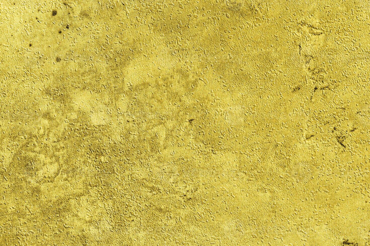 Texture of golden decorative plaster or concrete. Abstract gold grunge background. photo