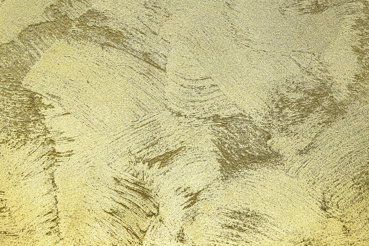Texture of golden decorative plaster or concrete. Abstract gold grunge background. photo