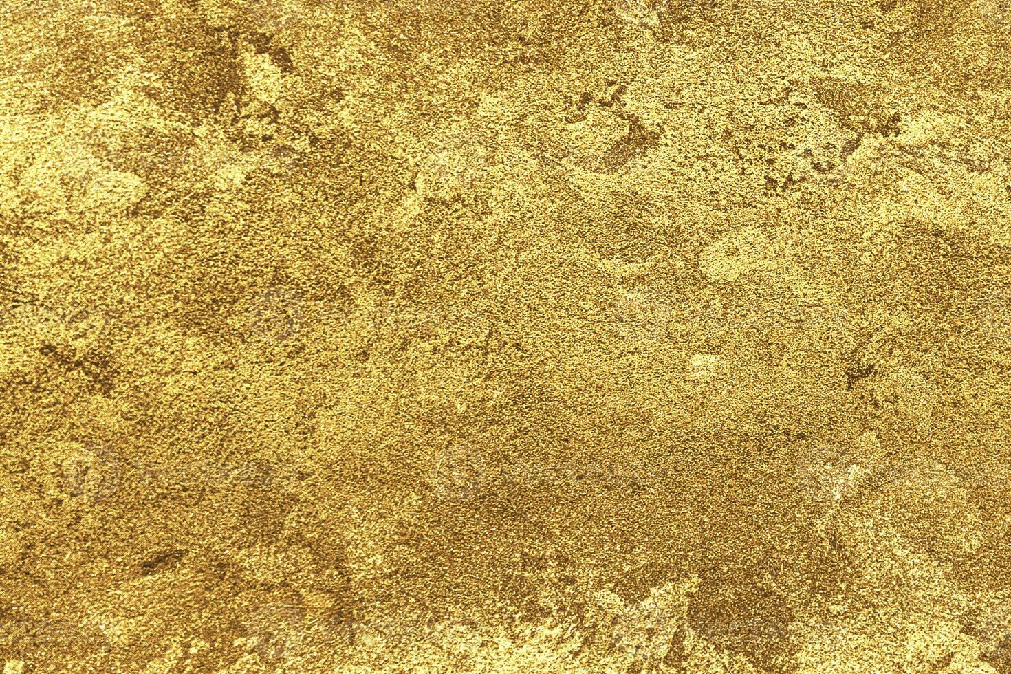 Texture of golden decorative plaster or concrete. Abstract gold grunge background. photo