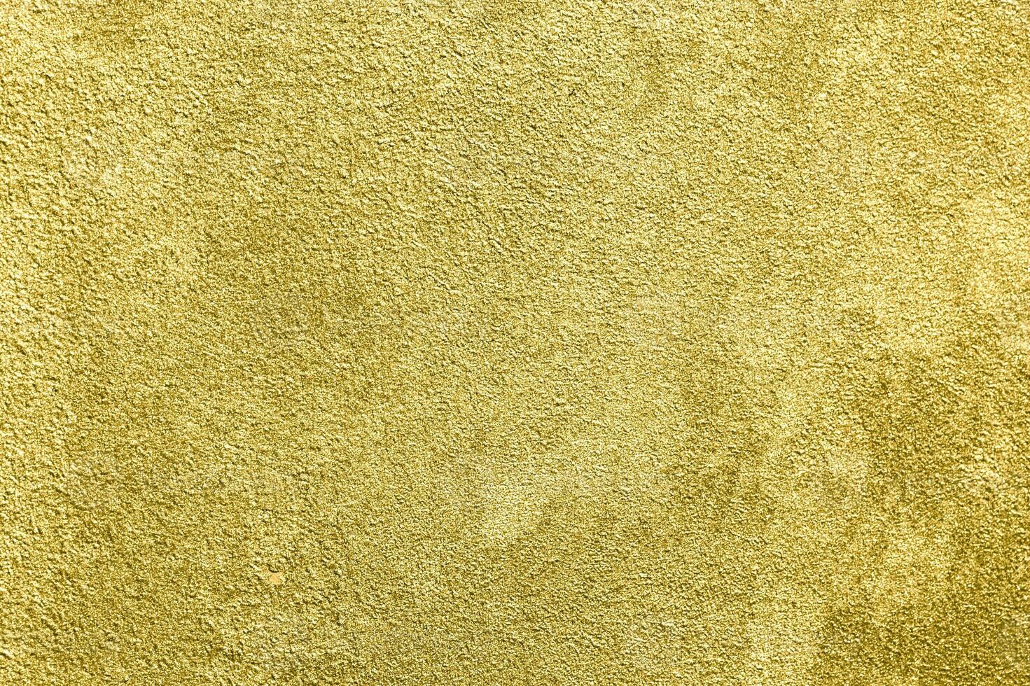 Texture of golden decorative plaster or concrete. Abstract gold grunge background. photo