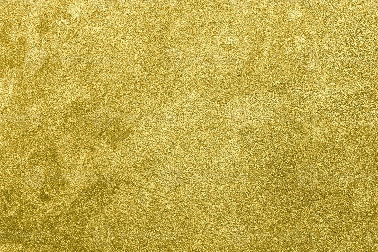 Texture of golden decorative plaster or concrete. Abstract gold grunge background. photo