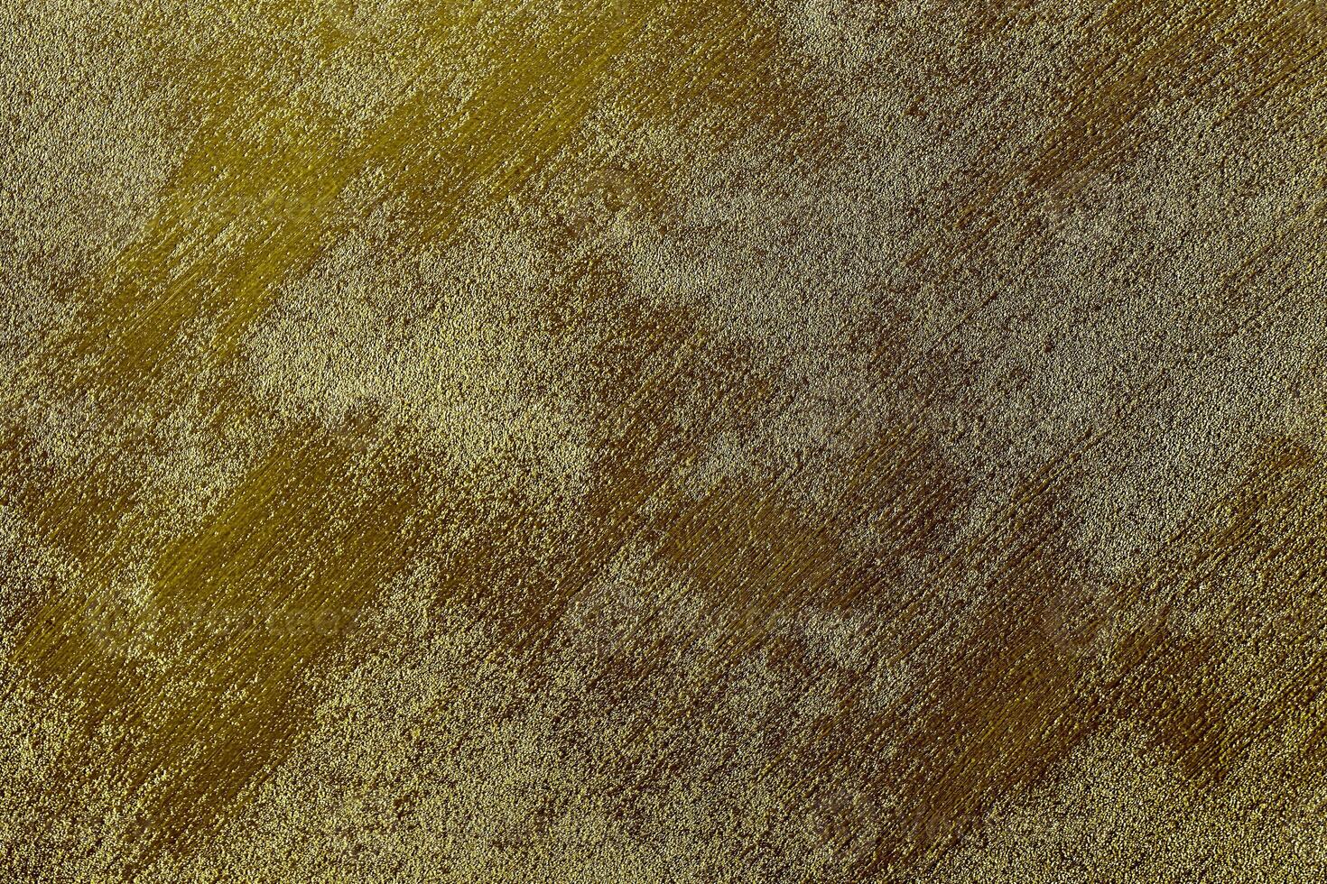 Texture of golden decorative plaster or concrete. Abstract gold grunge background. photo