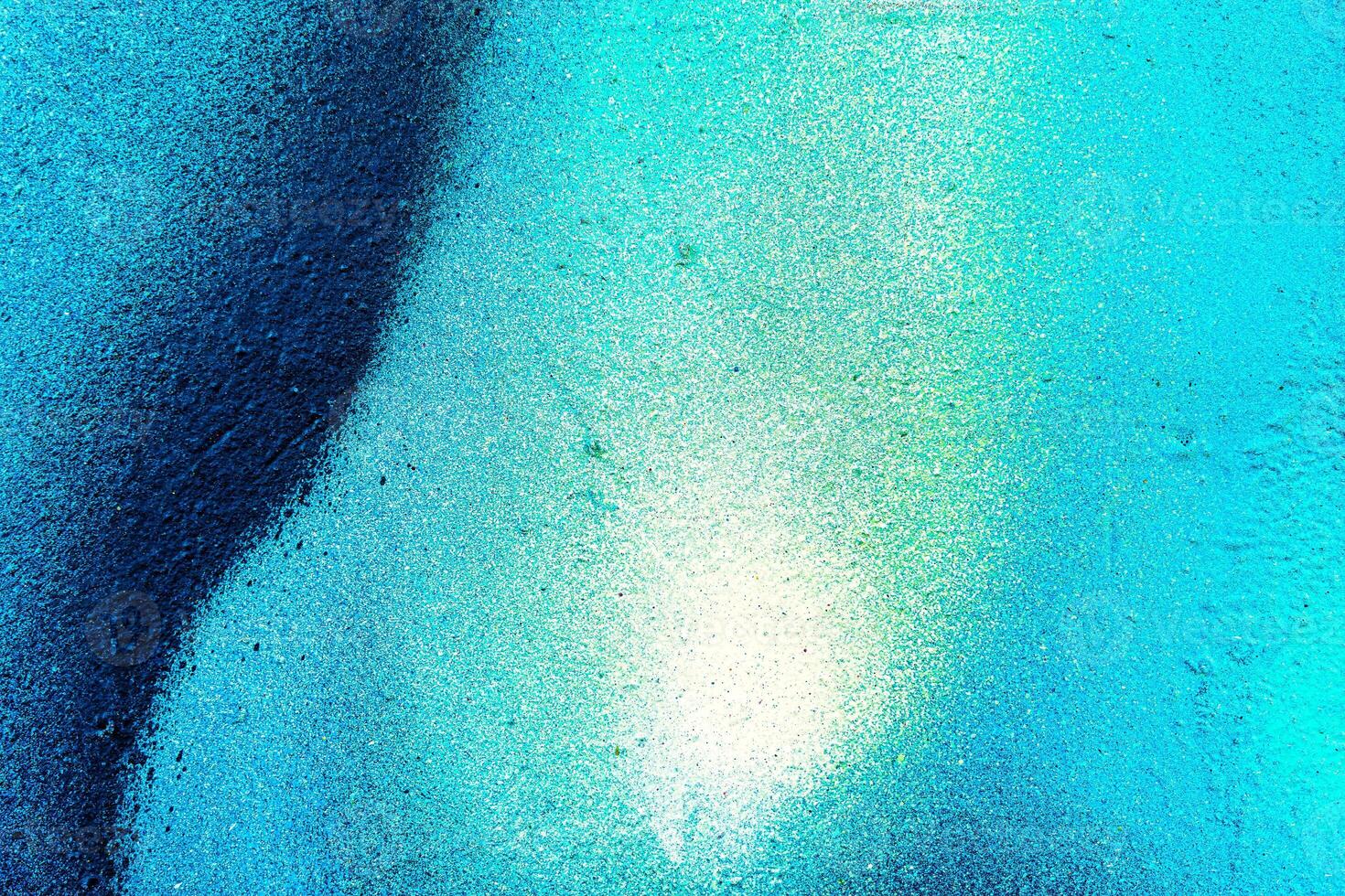 Colorful graffiti painted on a wall. Abstract urban background. Spray painting art. photo