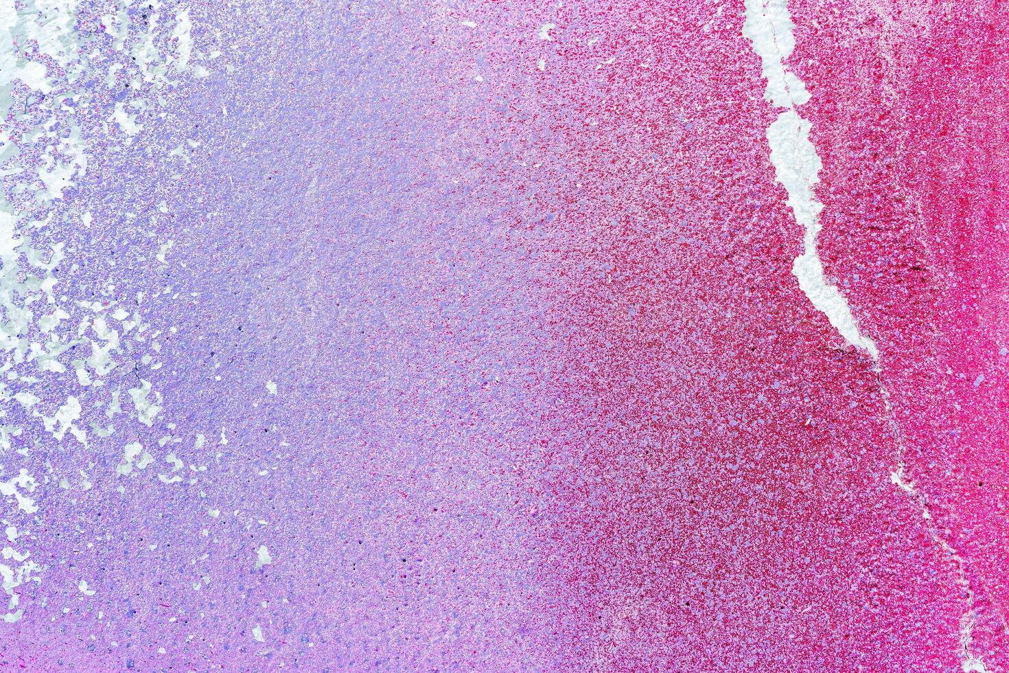 Colorful graffiti painted on a wall. Abstract urban background. Spray painting art. photo