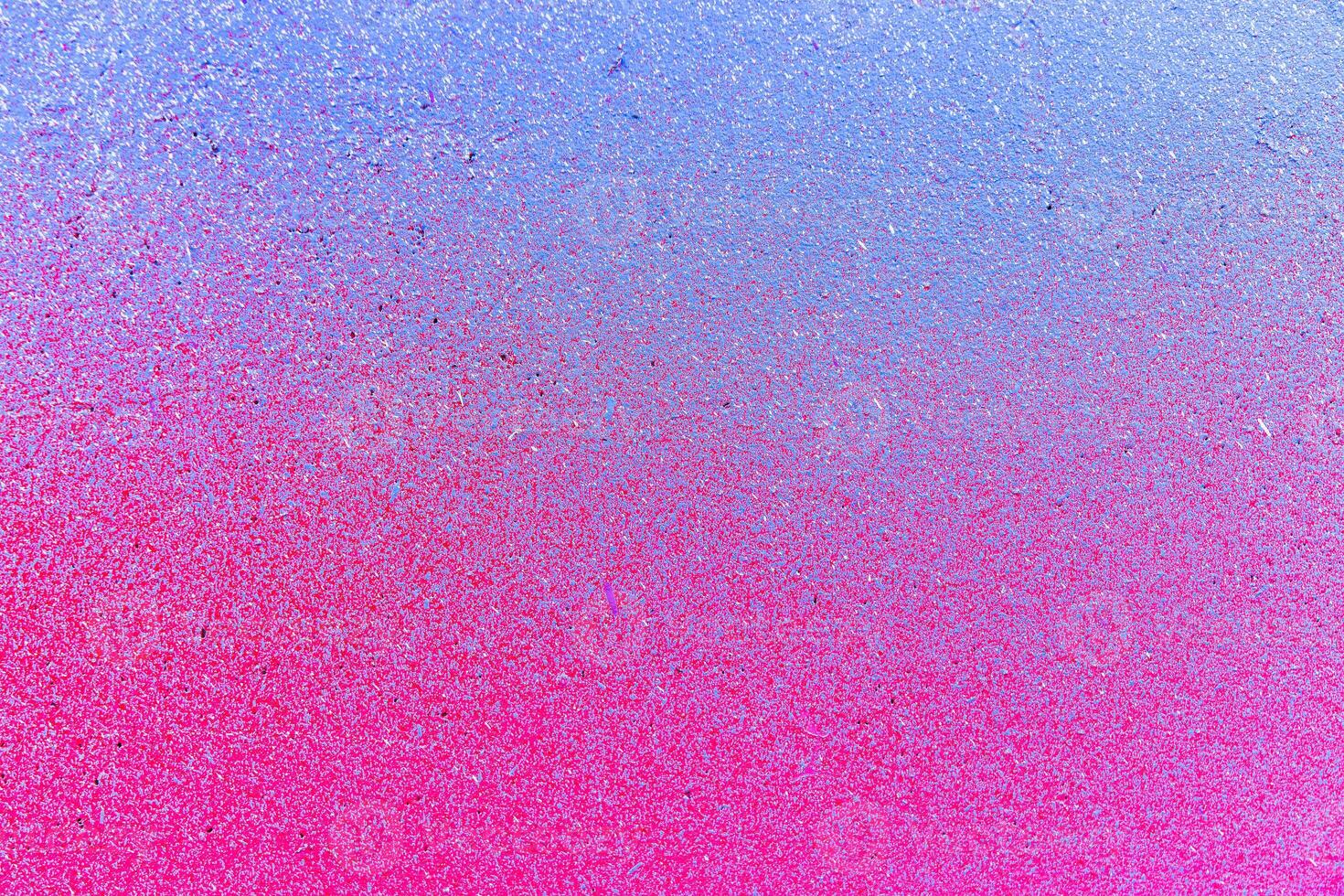 Colorful graffiti painted on a wall. Abstract urban background. Spray painting art. photo