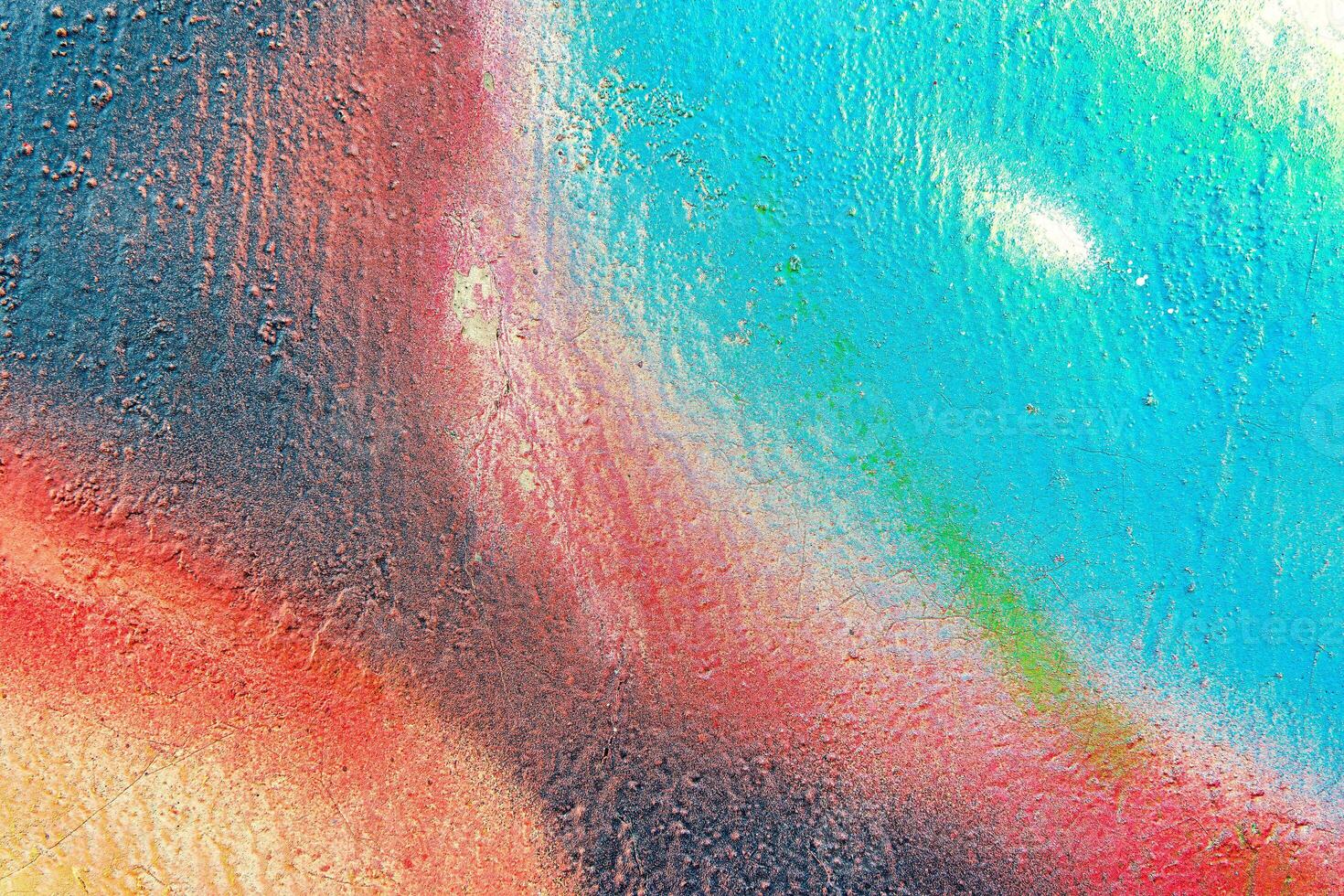Colorful graffiti painted on a wall. Abstract urban background. Spray painting art. photo