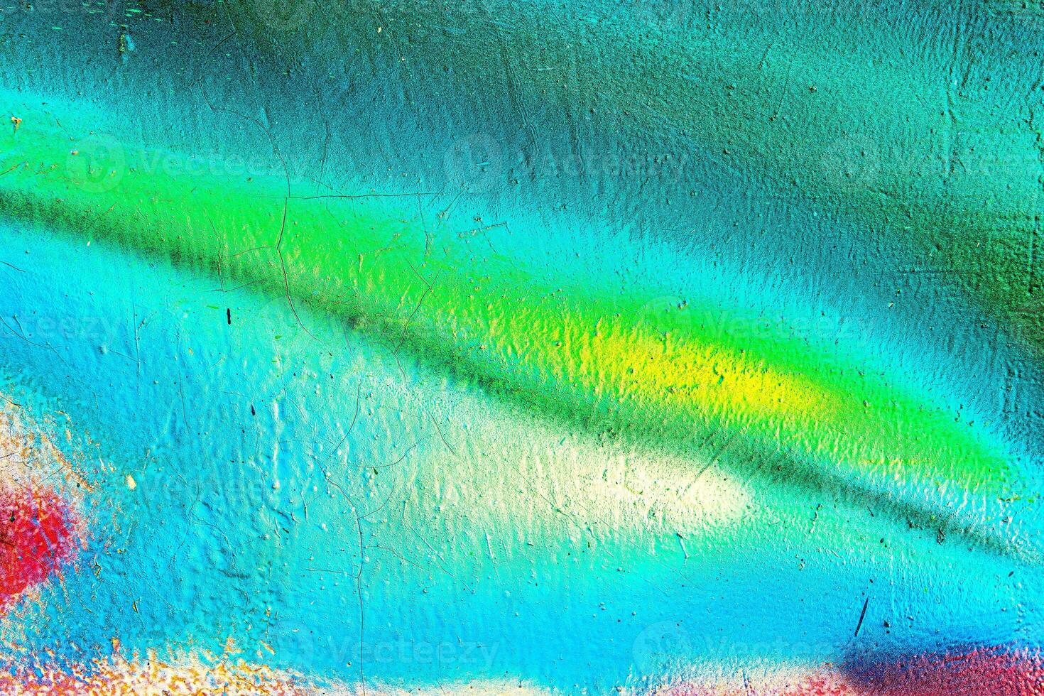 Colorful graffiti painted on a wall. Abstract urban background. Spray painting art. photo