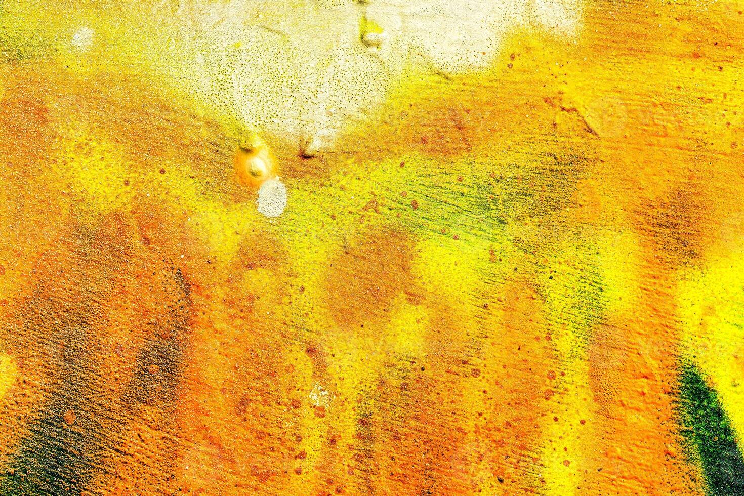 Colorful graffiti painted on a wall. Abstract urban background. Spray painting art. photo