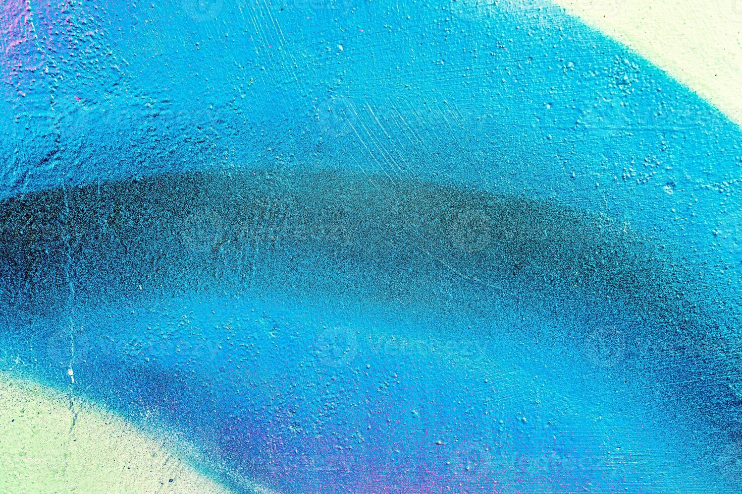 Colorful graffiti painted on a wall. Abstract urban background. Spray painting art. photo