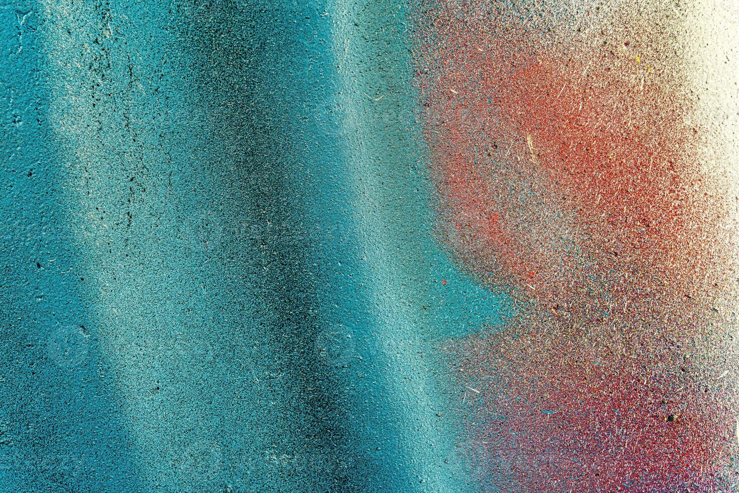 Colorful graffiti painted on a wall. Abstract urban background. Spray painting art. photo
