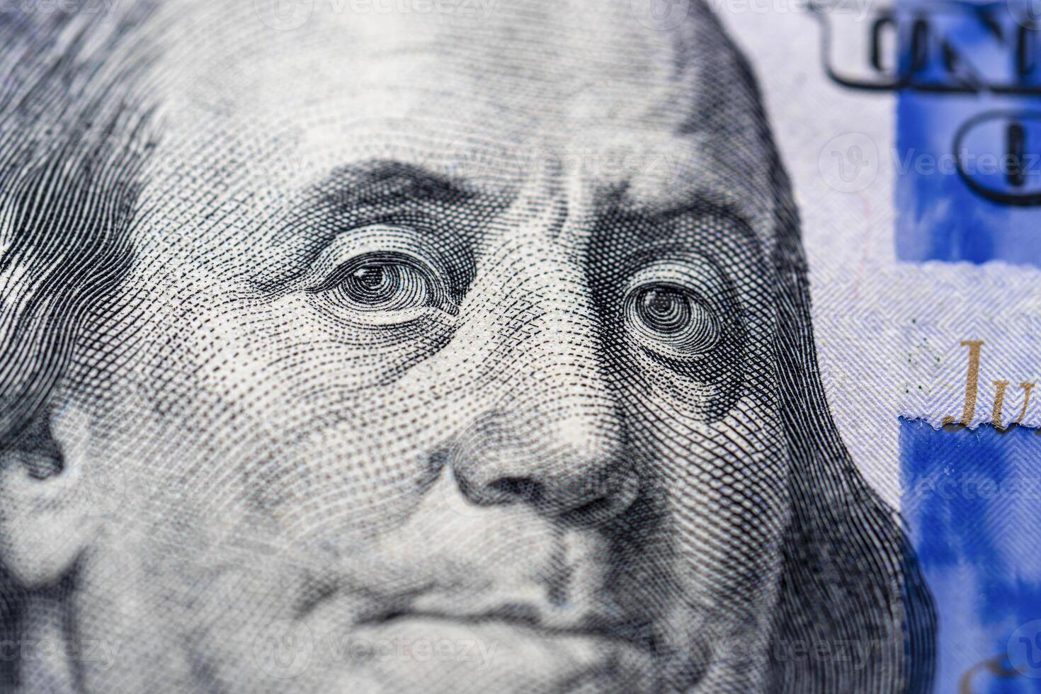 Portrait of American President Benjamin Franklin on a hundred dollar bill. photo