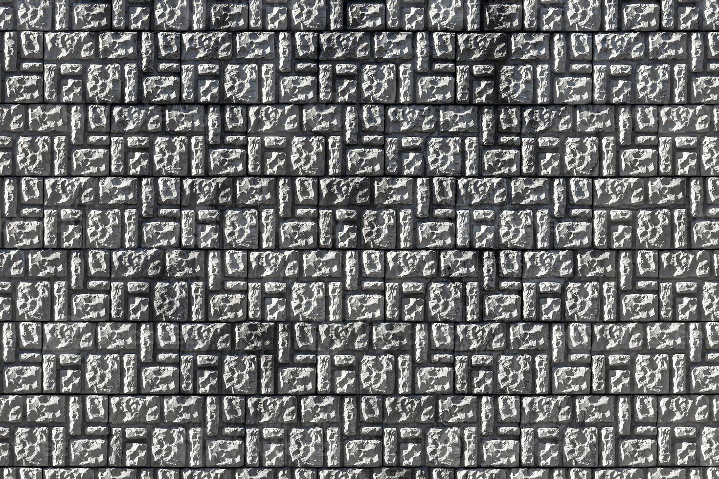 Texture of a decorative brick-like tiles. Abstract background for design. photo