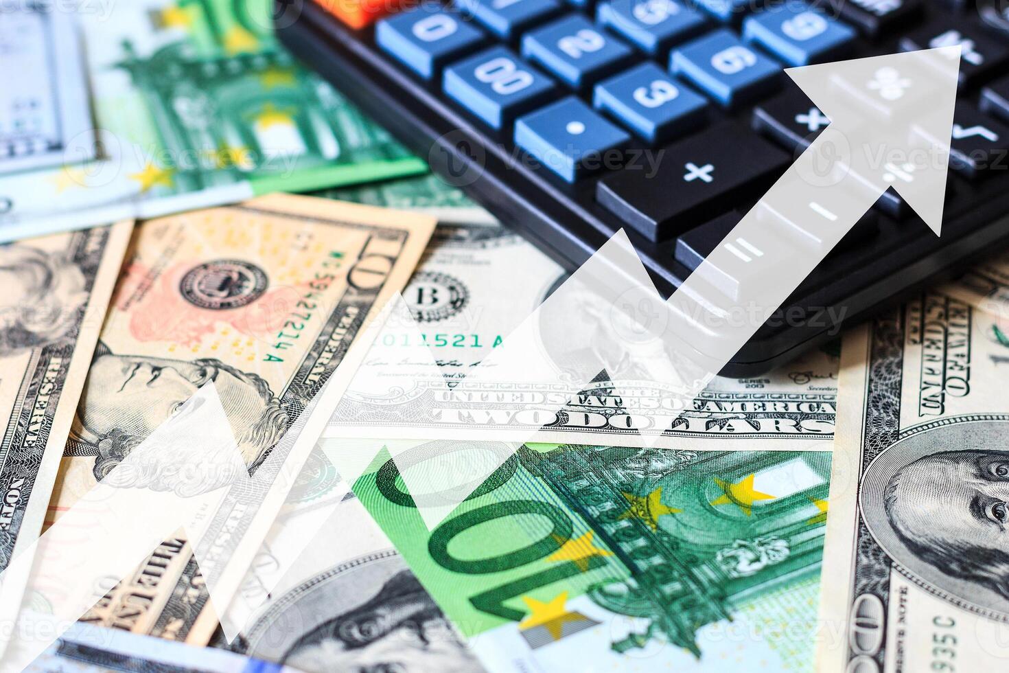 Dollar and euro bils and black calculator. photo