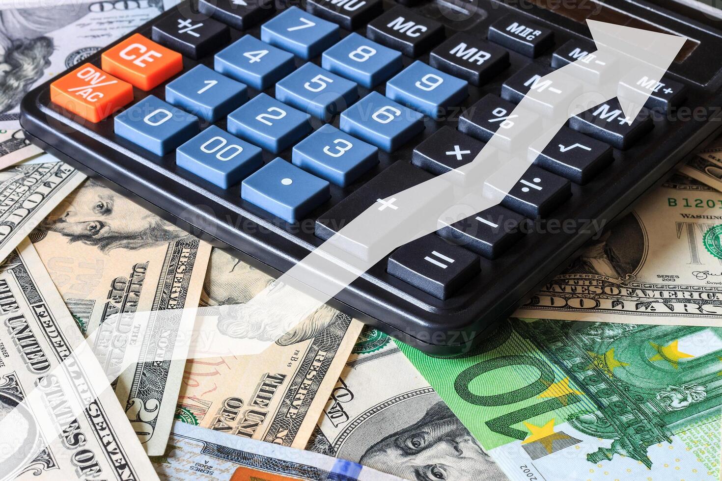 Dollar and euro bils and black calculator. photo