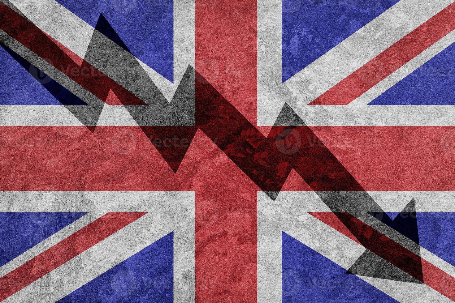 Arrow down on the background of the Great Britain flag. The concept of economic recession, depression and crisis. photo